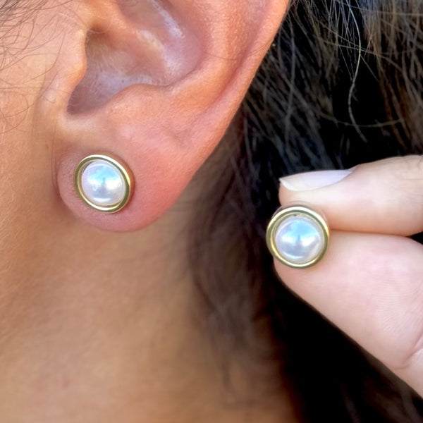 Small gold earrings with pearl