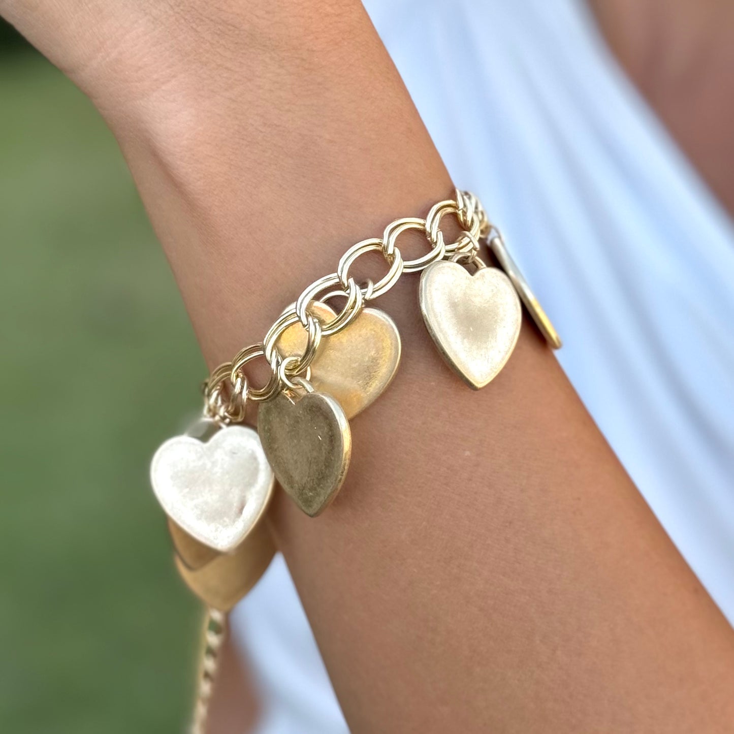 Gold bracelet with many hearts