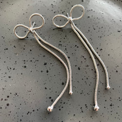 Long Bow Silver Earrings