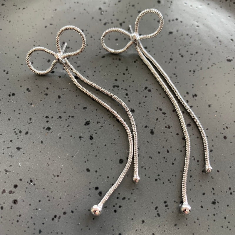 Long Bow Silver Earrings