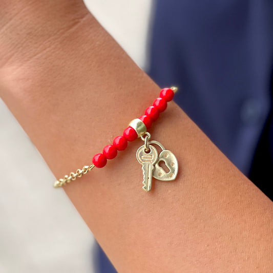 Gold Bracelet With Red, Key and Heart