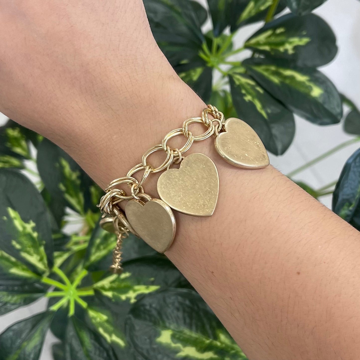 Gold bracelet with many hearts