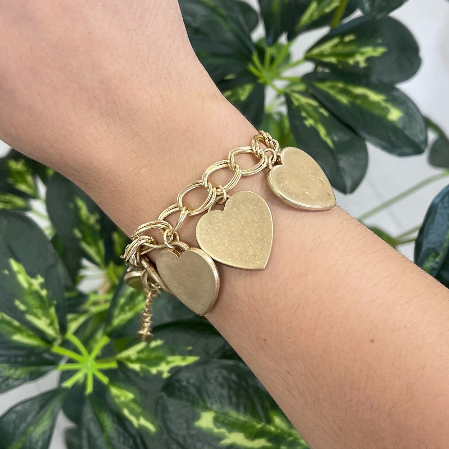 Gold bracelet with many hearts