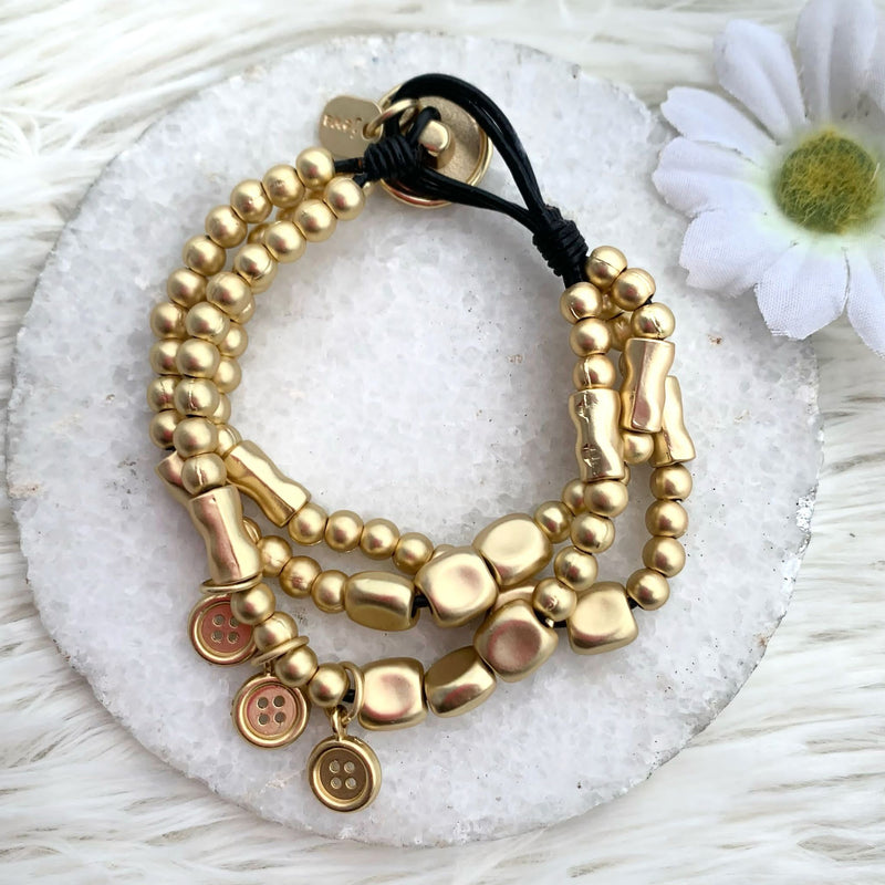 Gold Bracelet With Balls and Three Small Buttons