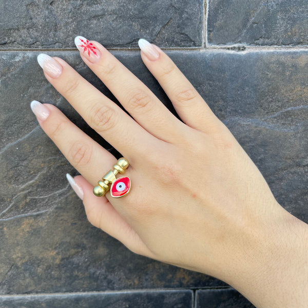 Gold ring with red eye