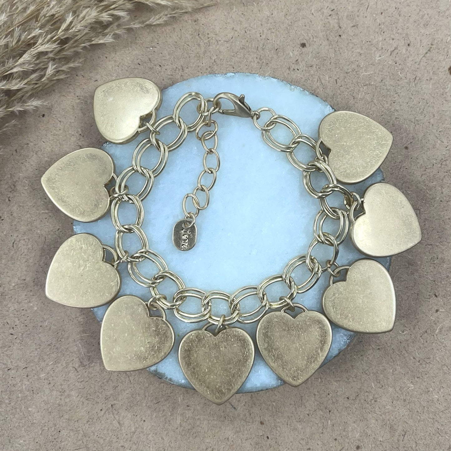 Gold bracelet with many hearts